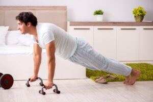 Man doing Push-Up Resistance Training Prior to Sleep for Weight Loss - Simply Good Sleep