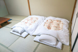 Tatami and futon in traditional Japanese ryokan - Navigating Cultural Sleep Norms While Traveling - Simply Good Sleep