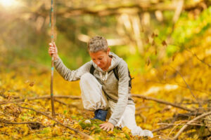 Woman immersing herself in the sights, sounds, smells, and textures of the forest - in Forest Bathing - A Natural Remedy for Better Sleep - by Simply Good Sleep